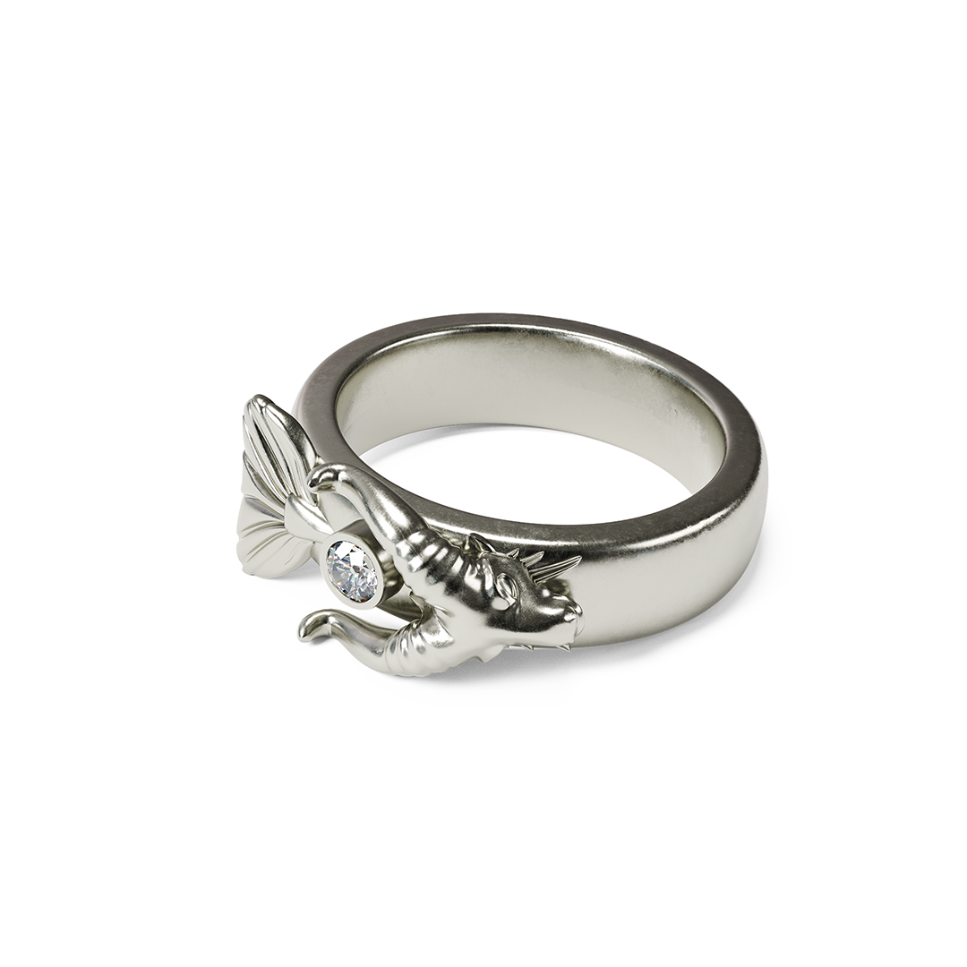 Silver ring with a bat design and a small gemstone in the center.